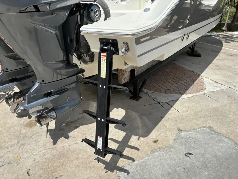 Slide: The Image of 2022 Pursuit S 288 boat with dual outboard motors on a trailer. - 9