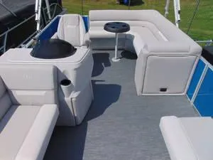 Slide: The Image of 2024 Godfrey Xperience 1680 CX 25 in. Package pontoon boat interior with seating and table. - 14