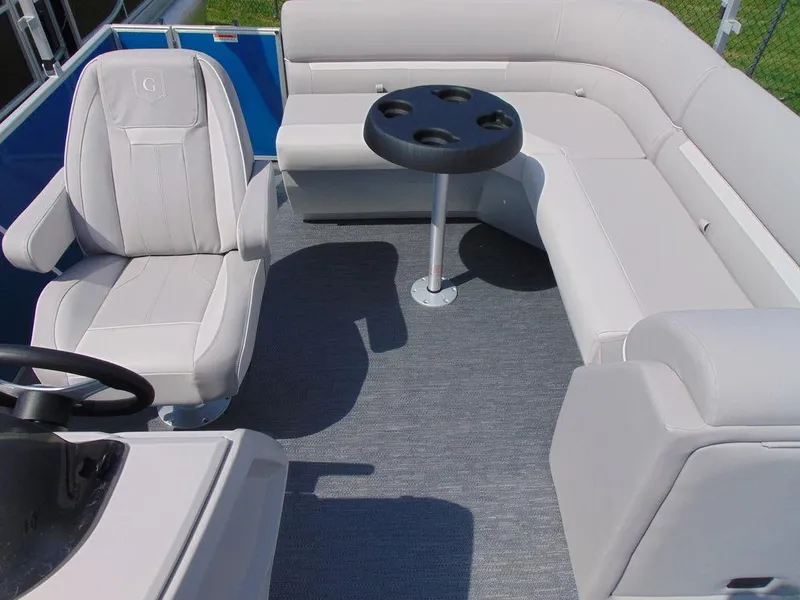 Slide: The Image of 2024 Godfrey Xperience 1680 CX 25 in. Package interior with seating and table. - 6