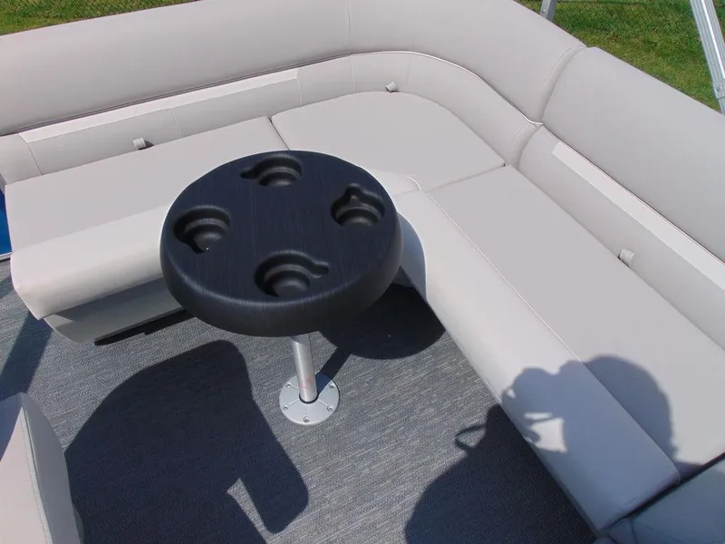 Slide: The Image of 2024 Godfrey Xperience 1680 CX 25 in. Package boat seating area with cup holder table. - 7
