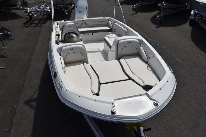 Slide: The Image of 2024 Stingray 182SC deck boat with spacious seating and modern design. - 13