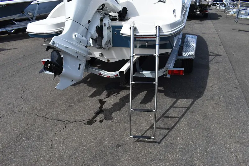 Slide: The Image of 2024 Stingray 182SC boat rear view with ladder and outboard motor. - 15