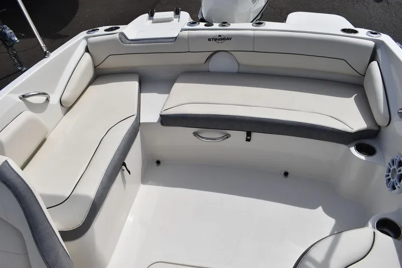 Slide: The Image of 2024 Stingray 182SC boat interior with white and gray seating. - 16