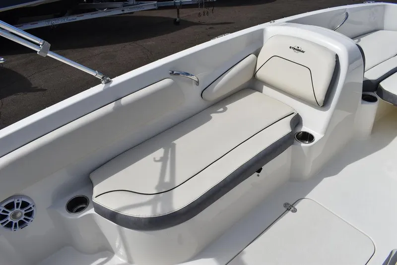Slide: The Image of 2024 Stingray 182SC boat interior with cushioned seating and cup holders. - 20