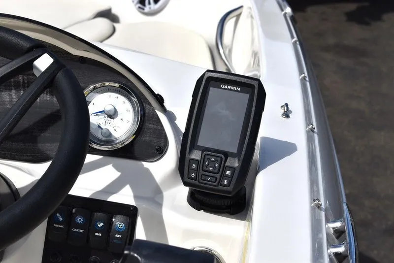 Slide: The Image of 2024 Stingray 182SC boat dashboard with Garmin GPS and control panel. - 29