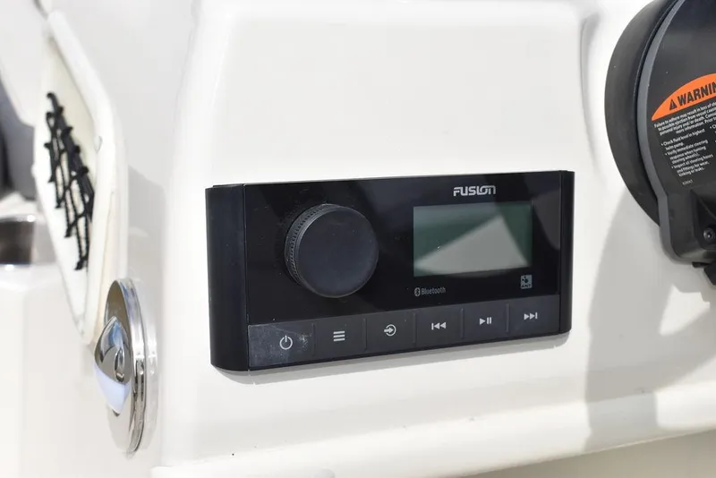 Slide: The Image of Fusion Bluetooth stereo system on 2024 Stingray 182SC boat dashboard. - 30