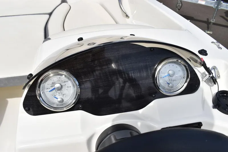 Slide: The Image of Dashboard of 2024 Stingray 182SC boat with dual gauges. - 32
