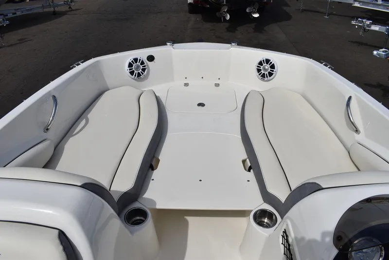 Slide: The Image of 2024 Stingray 182SC boat interior with spacious seating and cup holders. - 36