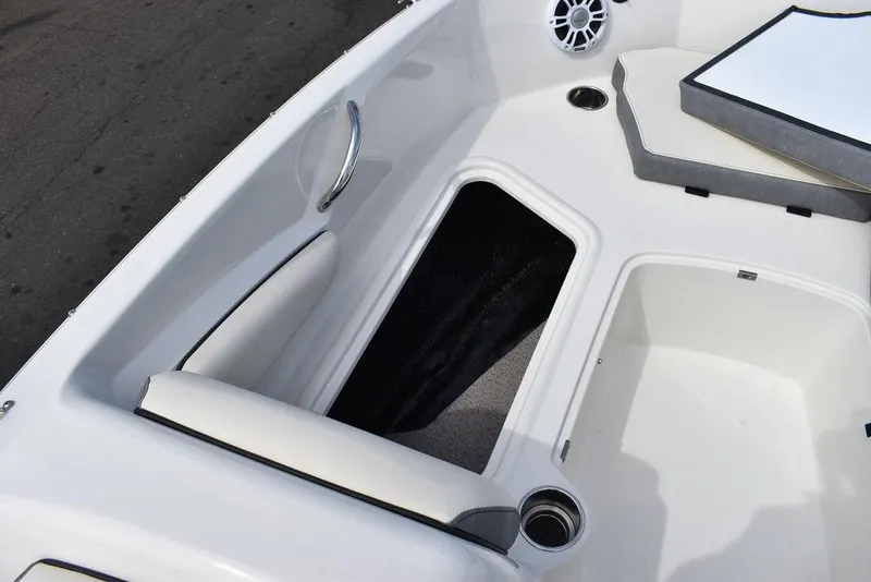 Slide: The Image of 2024 Stingray 182SC boat interior with storage compartment and seating. - 38