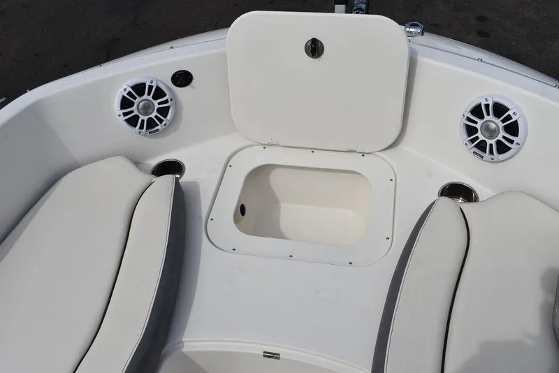 Slide: The Image of 2024 Stingray 182SC boat interior with storage compartment and speakers. - 40