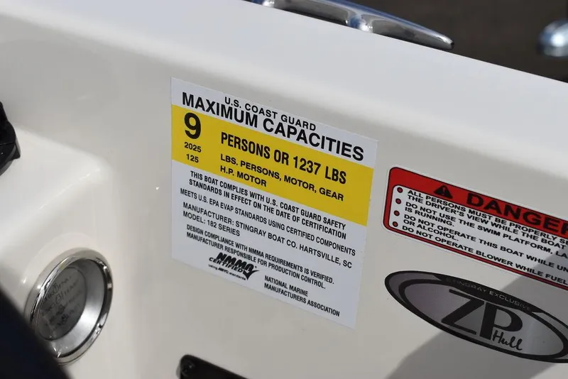 Slide: The Image of 2024 Stingray 182SC boat capacity label, U.S. Coast Guard maximum 9 persons or 1237 lbs. - 41