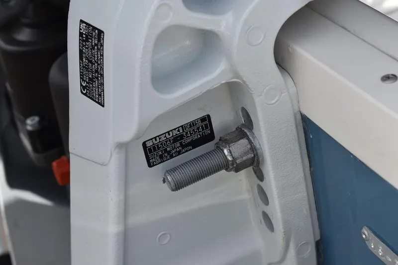 Slide: The Image of Close-up of 2024 Stingray 182SC boat engine mounting bolt and identification plates. - 44