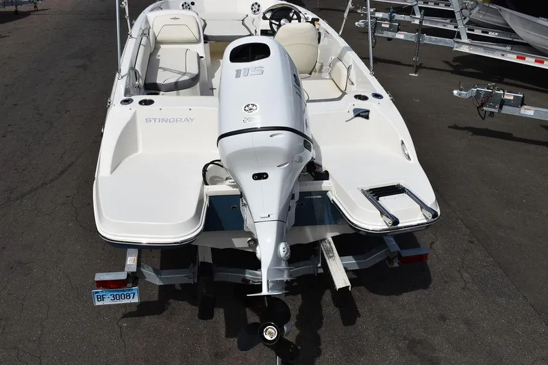 Slide: The Image of 2024 Stingray 182SC boat with outboard motor, rear view on trailer. - 5