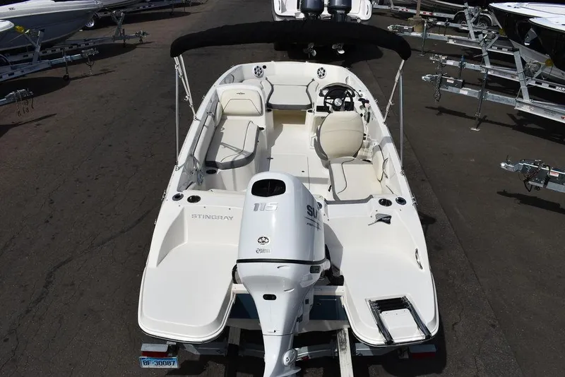 Slide: The Image of 2024 Stingray 182SC boat, top view, white interior, outboard motor. - 6