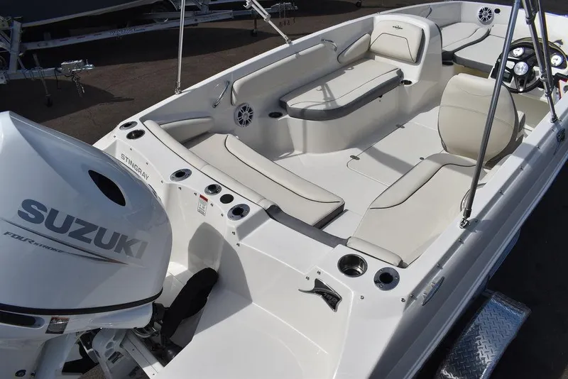 Slide: The Image of 2024 Stingray 182SC boat interior with Suzuki outboard motor. - 8