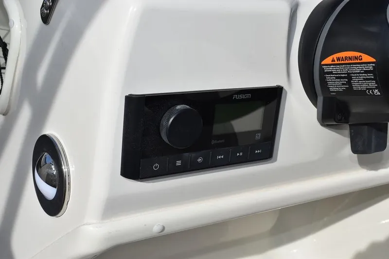 Slide: The Image of 2024 Stingray 191DC boat dashboard with Fusion audio system. - 24