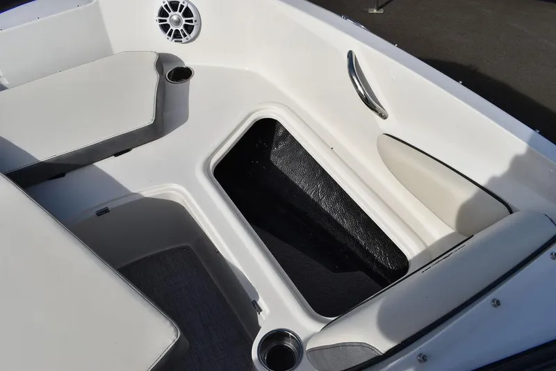 Slide: The Image of 2024 Stingray 191DC boat interior with storage compartment and seating. - 35