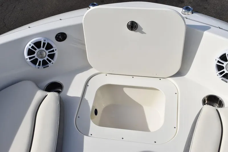 Slide: The Image of 2024 Stingray 191DC boat interior with storage compartment and speakers. - 36