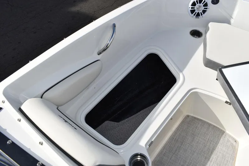 Slide: The Image of 2024 Stingray 191DC boat interior with seating and storage compartment. - 37