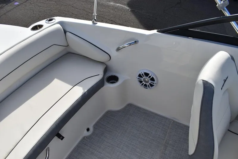 Slide: The Image of 2024 Stingray 191DC boat interior with cushioned seating and cup holders. - 42