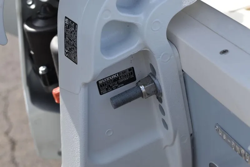 Slide: The Image of Close-up of a 2024 Stingray 191DC boat engine mount with Suzuki label. - 43