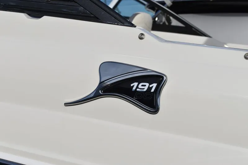 Slide: The Image of 2024 Stingray 191DC boat model emblem on white exterior. - 47
