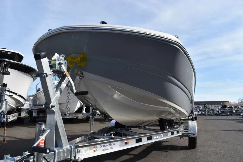 Slide: The Image of 2024 Stingray 191DC boat on a trailer, front view. - 48