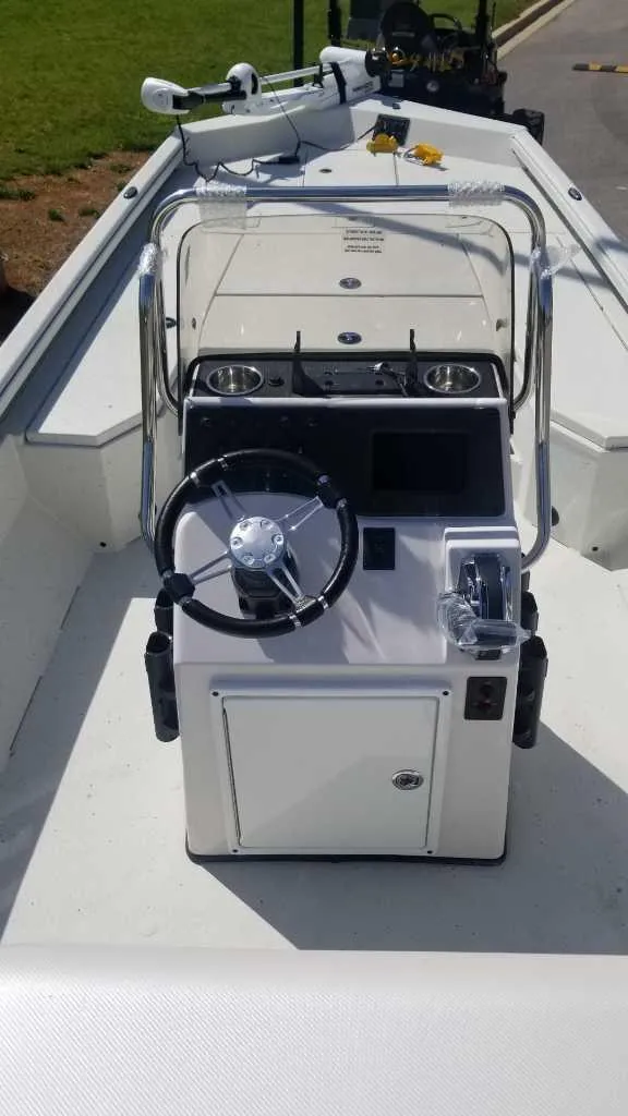 Slide: The Image of 2024 Ranger RB210 boat console with steering wheel and controls. - 3