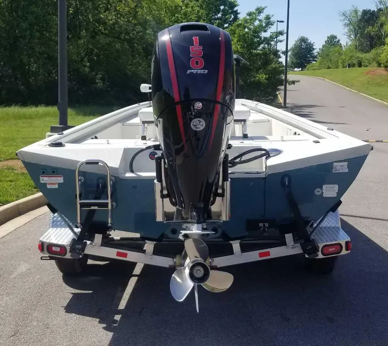 Slide: The Image of 2024 Ranger RB210 boat with 150 HP motor on trailer. - 5