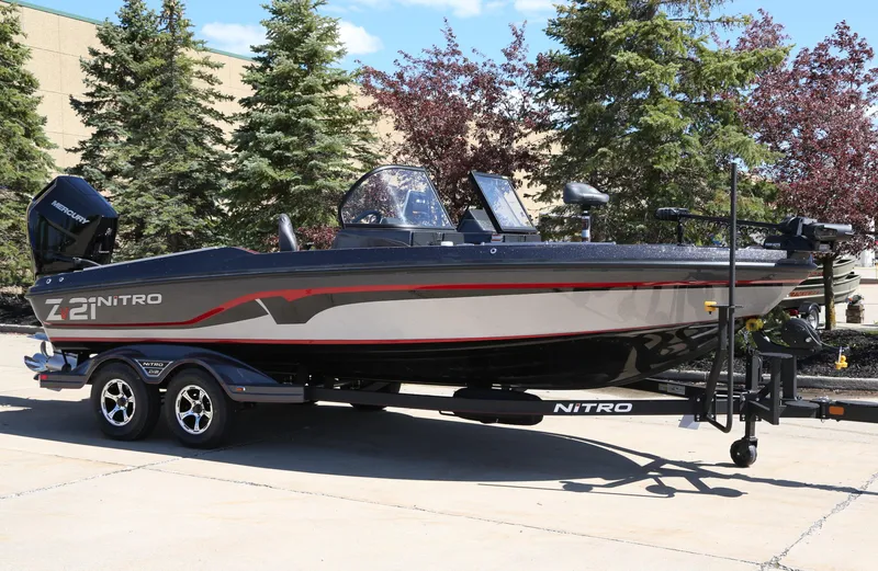 The Image of 2024 Nitro ZV21 fishing boat on a trailer, side view. - 0