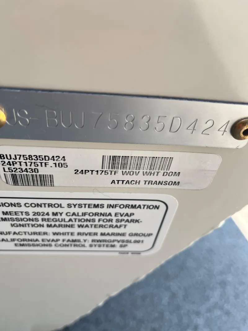 Slide: The Image of 2024 Tracker Pro Team 175 TF transom with serial number and compliance labels. - 48