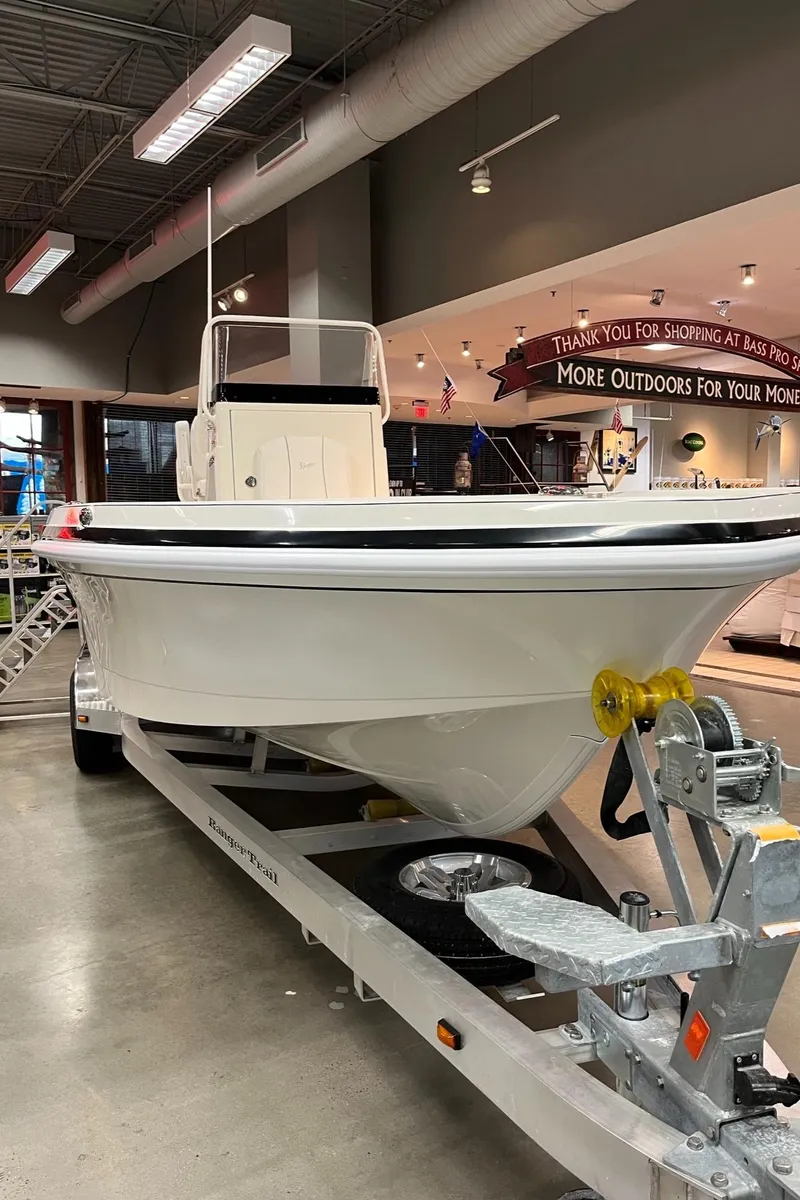 Slide: The Image of 2024 Ranger 2360 Bay boat on display in showroom. - 2