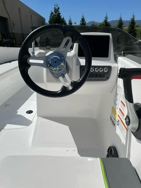 Slide: The Image of 2024 Tahoe T16 boat cockpit with steering wheel and control panel. - 3