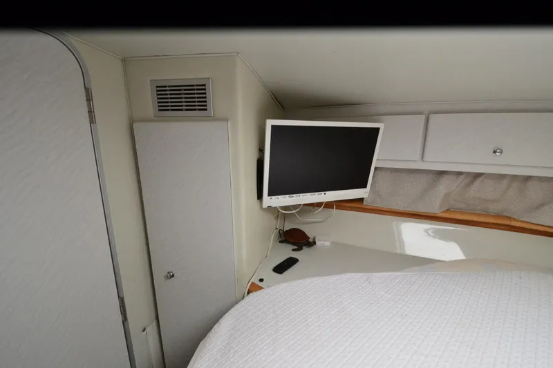 Slide: The Image of Interior of 1996 Wellcraft Portofino 43 yacht with TV and storage cabinets. - 12