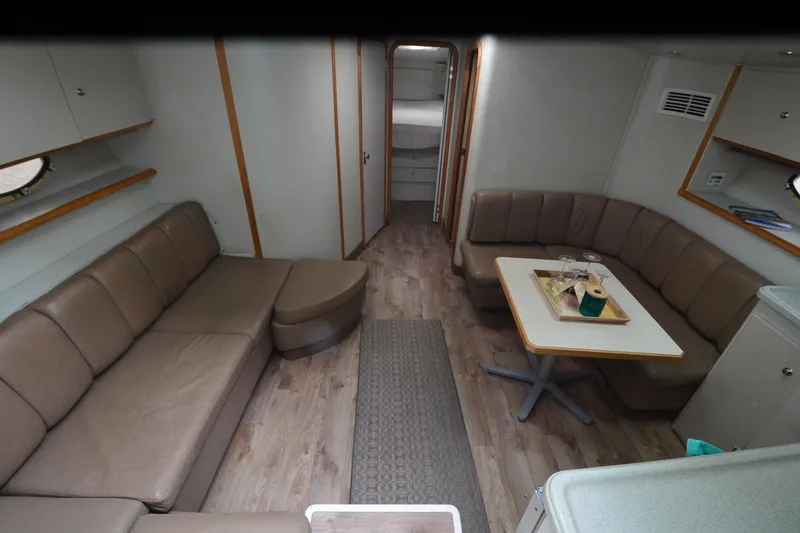 Slide: The Image of Interior of 1996 Wellcraft Portofino 43 yacht with leather seating and dining area. - 22
