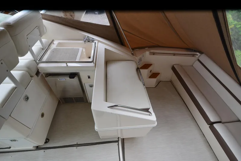 Slide: The Image of Interior of 1996 Wellcraft Portofino 43 yacht with seating and kitchenette area. - 23