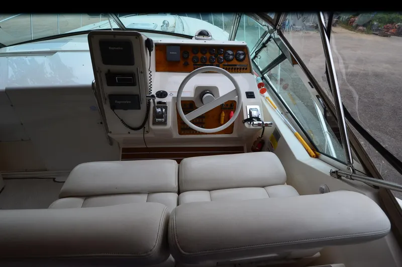 Slide: The Image of Interior cockpit of 1996 Wellcraft Portofino 43 boat with steering wheel and controls. - 25
