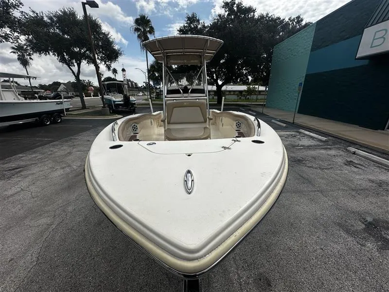 Slide: The Image of 2021 Scout 215 XSF boat parked outdoors, front view. - 4