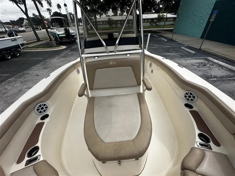 Slide: The Image of 2021 Scout 215 XSF boat interior with seating and speakers. - 6