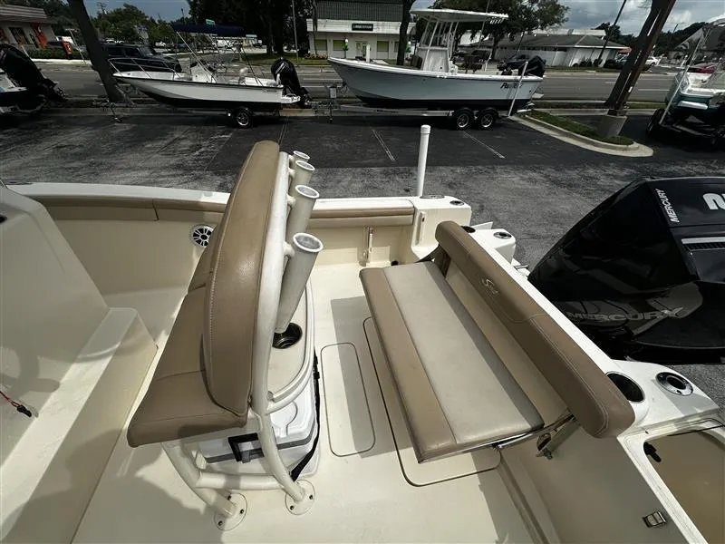 Slide: The Image of 2021 Scout 215 XSF boat interior with seating and rod holders. - 9