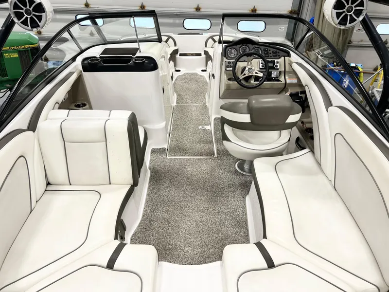 Slide: The Image of 2014 Yamaha Boats 242 Limited S interior with plush seating and modern dashboard. - 10
