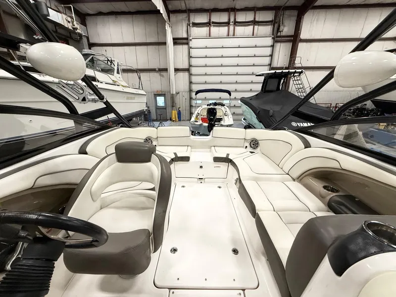 Slide: The Image of Interior of a 2014 Yamaha Boats 242 Limited S, featuring spacious seating and sleek design. - 11