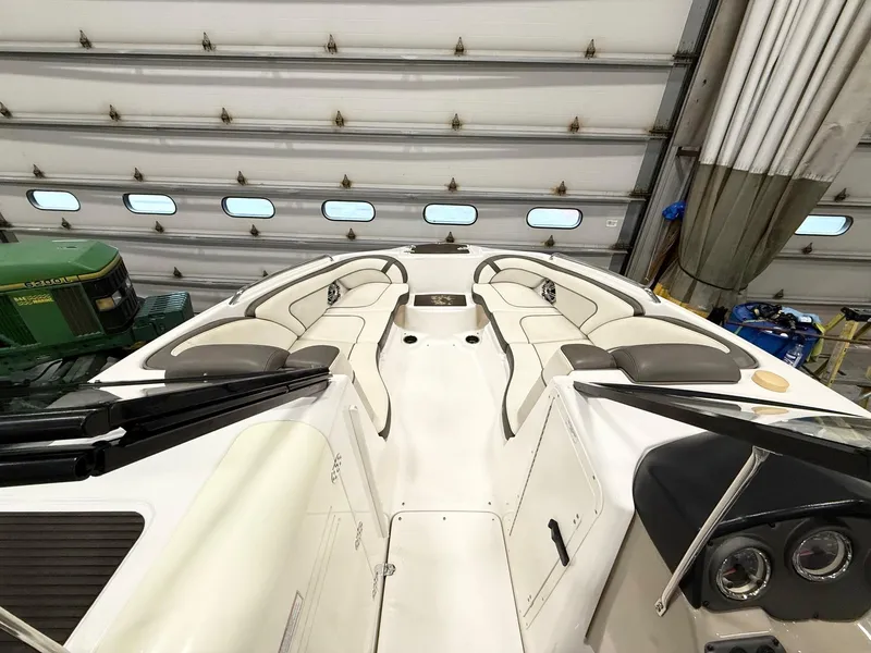 Slide: The Image of 2014 Yamaha Boats 242 Limited S interior with seating, stored indoors. - 14