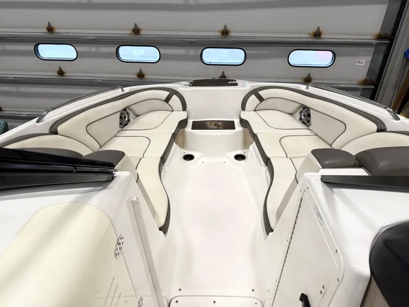 Slide: The Image of 2014 Yamaha Boats 242 Limited S interior with white seating and sleek design. - 15