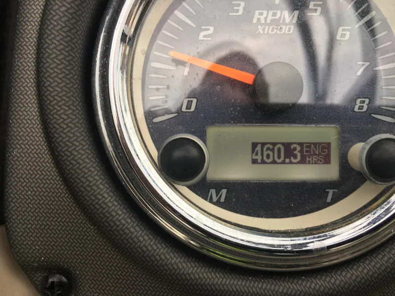 Slide: The Image of Close-up of 2014 Yamaha Boats 242 Limited S engine hour meter showing 460.3 hours. - 23