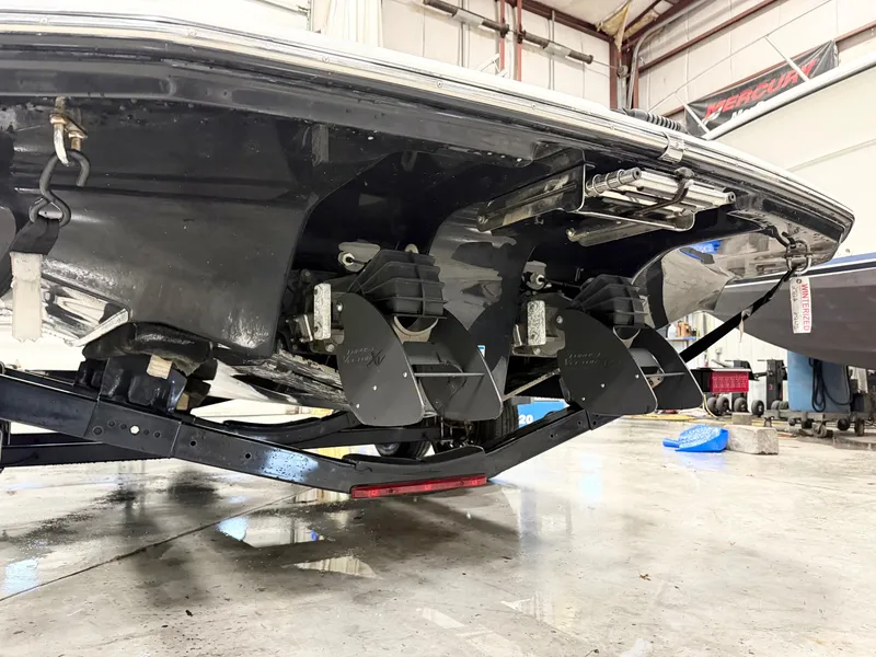 Slide: The Image of 2014 Yamaha Boats 242 Limited S in a garage, showing dual jet propulsion system. - 5