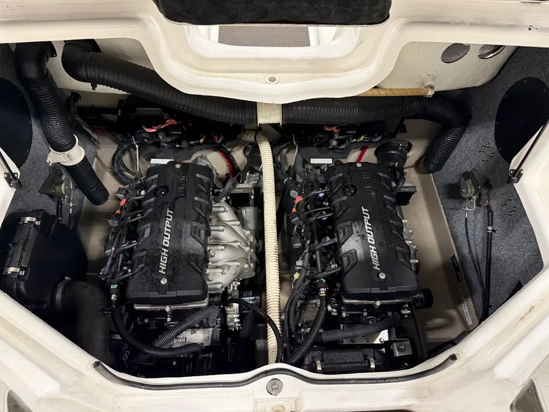 Slide: The Image of 2014 Yamaha Boats 242 Limited S engine compartment with dual high-output engines. - 7