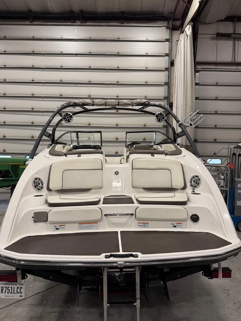Slide: The Image of 2014 Yamaha Boats 242 Limited S in a garage, rear view. - 8