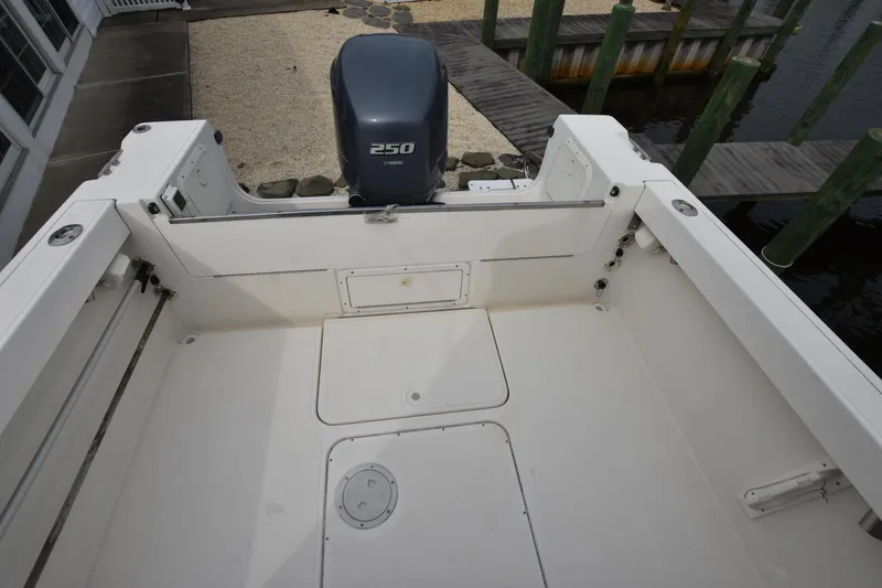 Slide: The Image of 1994 Pursuit 2350 boat deck with 250 HP outboard motor. - 11