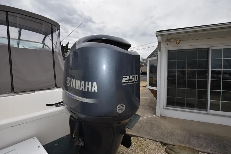 Slide: The Image of 1994 Pursuit 2350 boat with Yamaha 250 outboard motor. - 7